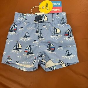 Ruffle Butts Blue Sailboat Kids Swim Trunks